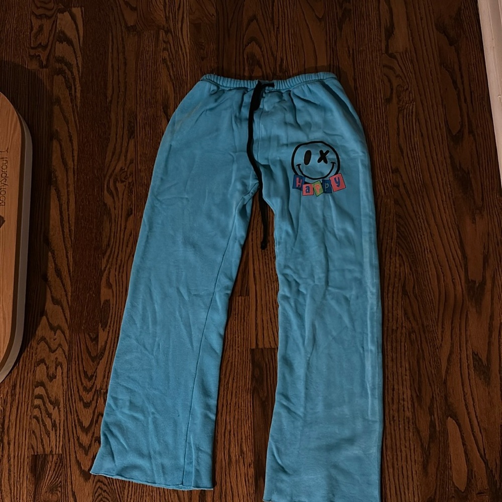 neon blue Love Junkie wide leg sweatpants with a decal on the front.